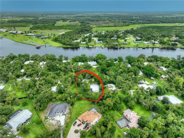 Aerial perspective of suburban area with a large body of water