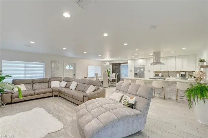 Living room featuring recessed lighting and light wood-type flooring