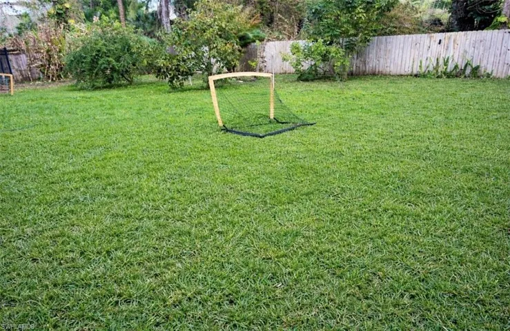 View of fenced backyard