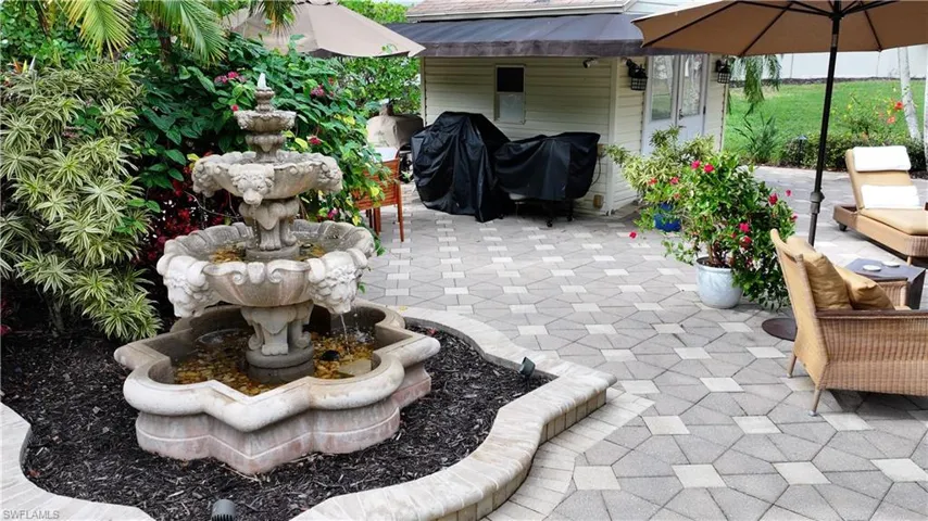 View of patio featuring area for grilling