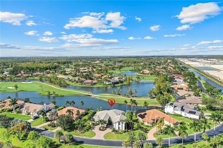 Back of home faces North and overlooks the 4th tee, golf course and 2 lakes