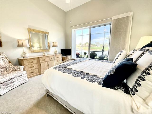 Full Guest Suite overlooks lanai, pool, golf course and lakes.  Bed in picture is a king-sized bed.