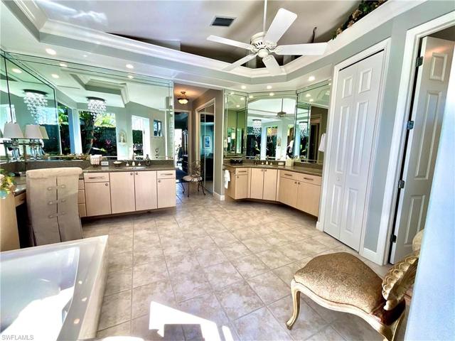 Owners Suite features an oversized bathroom with a walk-in multiple head shower large enough for 2 people.  Soaking tub overlooks a private walled courtyard.  His and hers vanities, a water and linen closet.