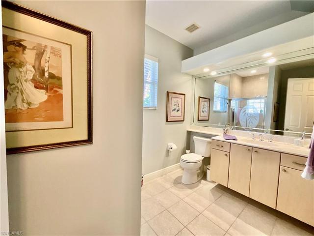 Guest suite bathroom features a walk in shower and closet.