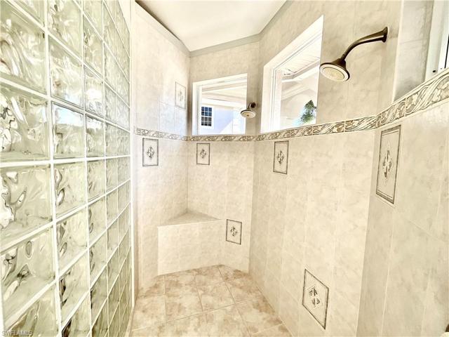 Owners Suite features an oversized bathroom with a walk-in multiple head shower large enough for 2 people.  Soaking tub overlooks a private walled courtyard.  His and hers vanities, a water and linen closet.