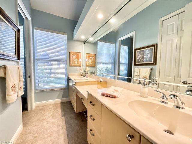 Guest suite bathroom features a walk in shower and closet.