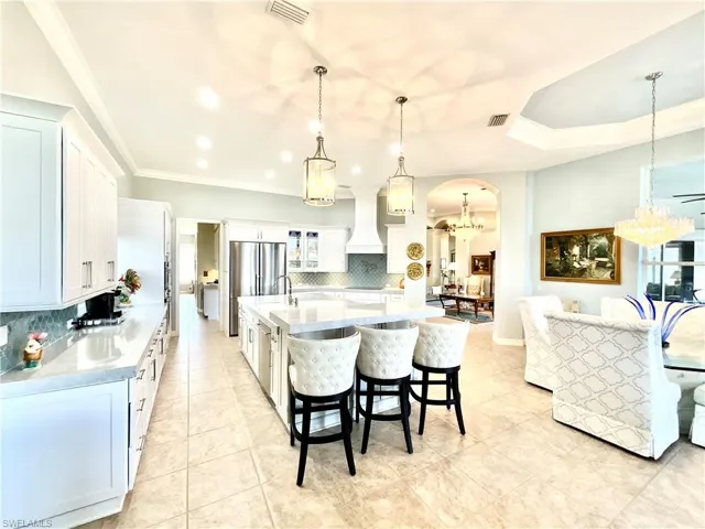 Custom chefs kitchen provides ample prep space for entertaining.
