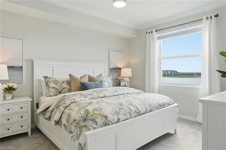 Bedroom with carpet and crown molding