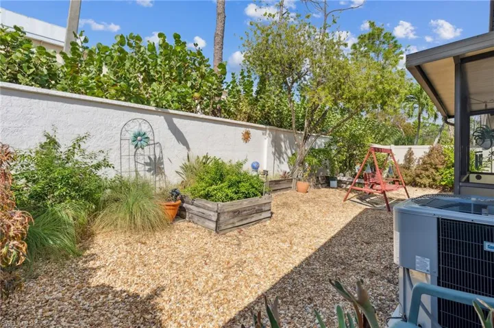 View of yard featuring central AC unit and a playground