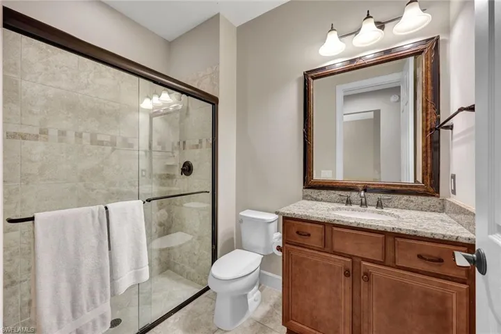 Guest bathroom with sliding glass door.