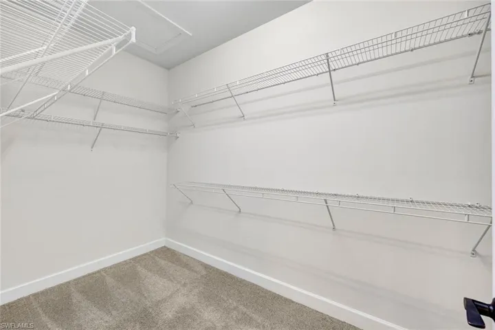 Primary bedroom walk-in closets!