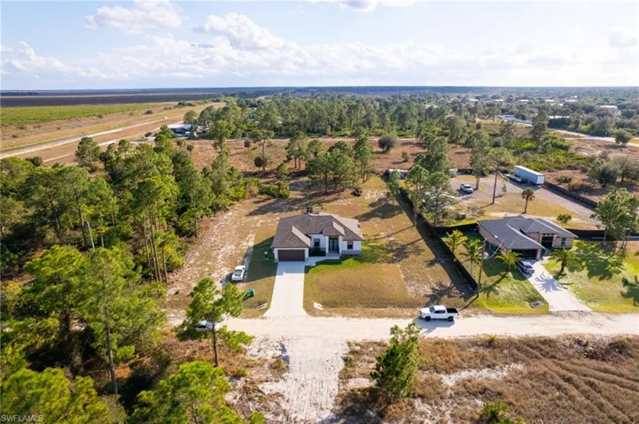 Aerial view of property and surrounding area with rural landscape