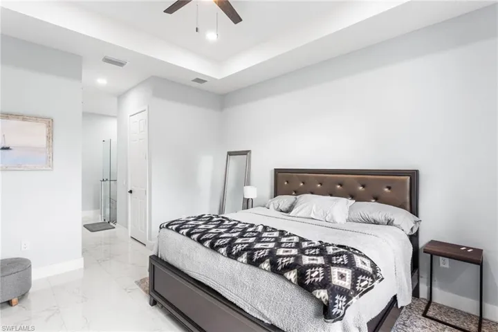Bedroom with a ceiling fan, recessed lighting, and a closet