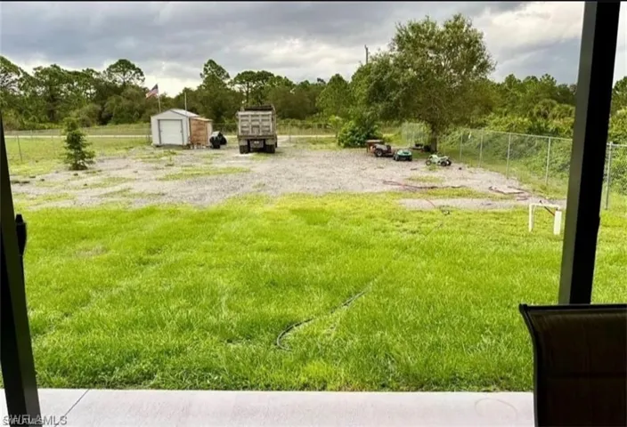 View of yard with an outbuilding
