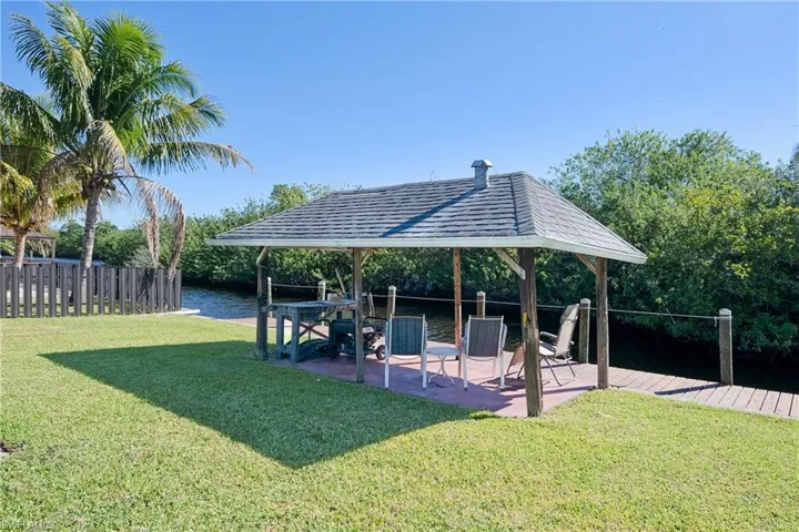 View of yard featuring a gazebo and a water view