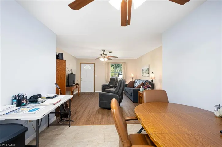 Dining space featuring ceiling fan and tile patterned flooring