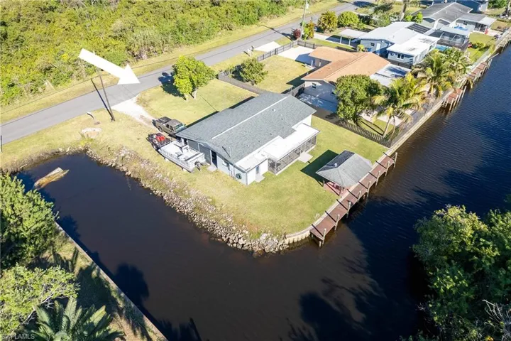 Aerial view featuring a residential view and a water view
