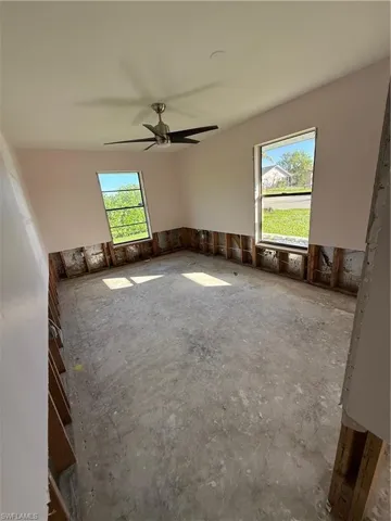 Empty room featuring ceiling fan