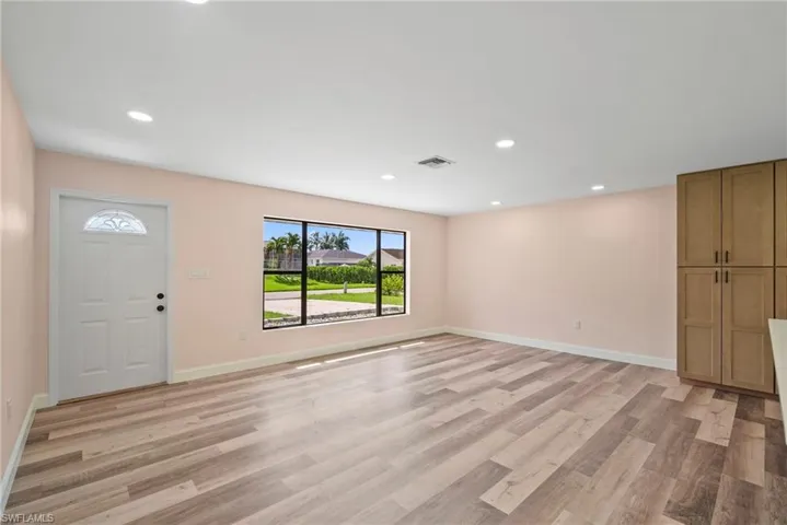 Unfurnished living room featuring light hardwood / wood-style floors