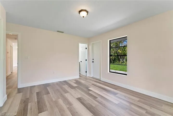 Unfurnished room with light wood-type flooring