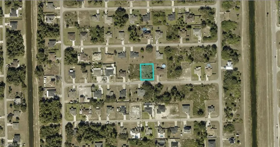 Aerial Map. Indicating the parcel of land within a neighborhood context