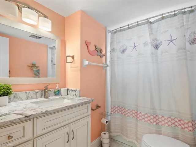 Full bath featuring vanity and toilet
