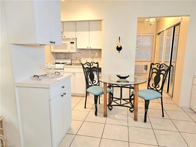 Dining room featuring sink and light tile floors