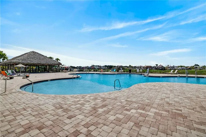 Community pool featuring a patio
