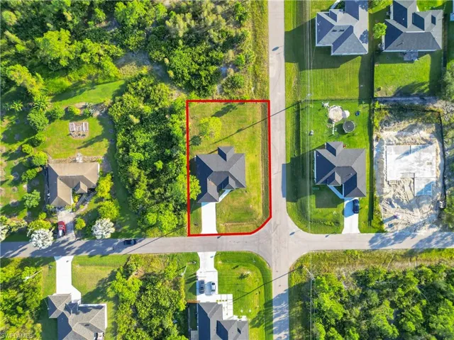 Aerial perspective of suburban area featuring property parcel outlined