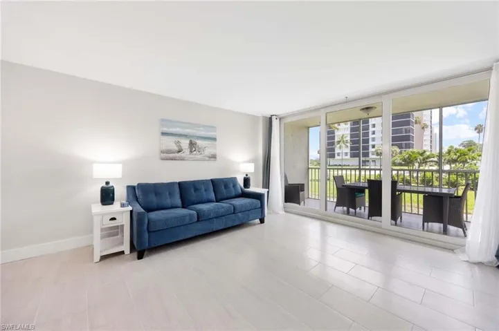 Living room with floor to ceiling windows and healthy amount of natural light