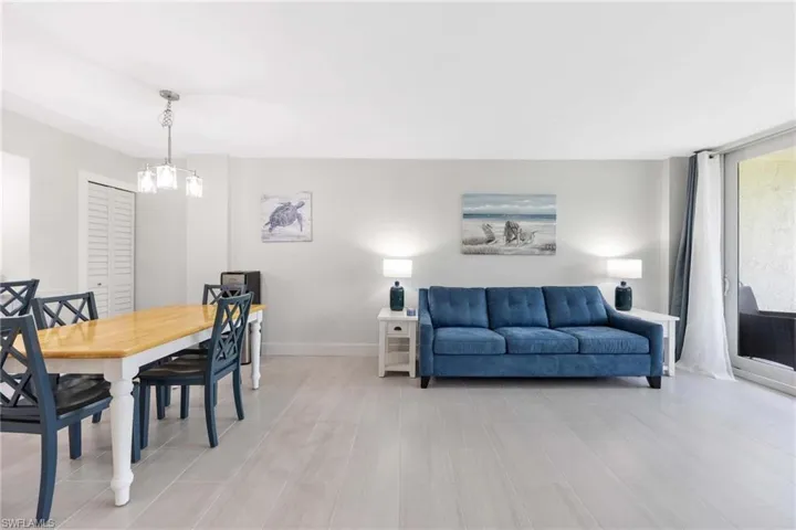Dining room featuring a chandelier and light wood-type flooring