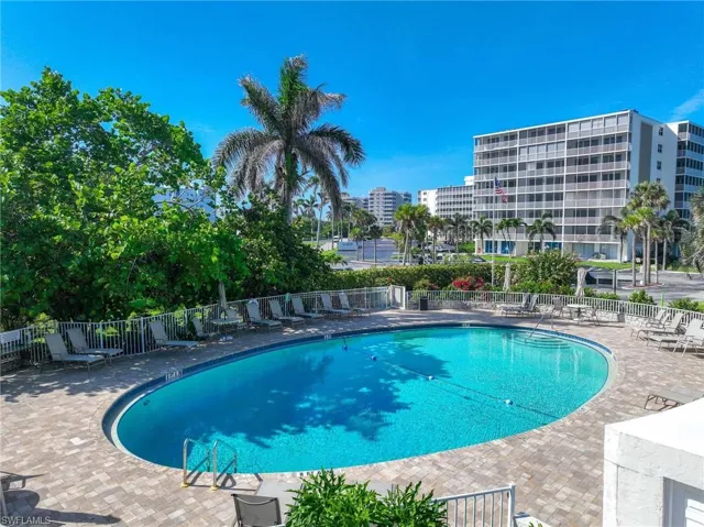 Community pool featuring a patio