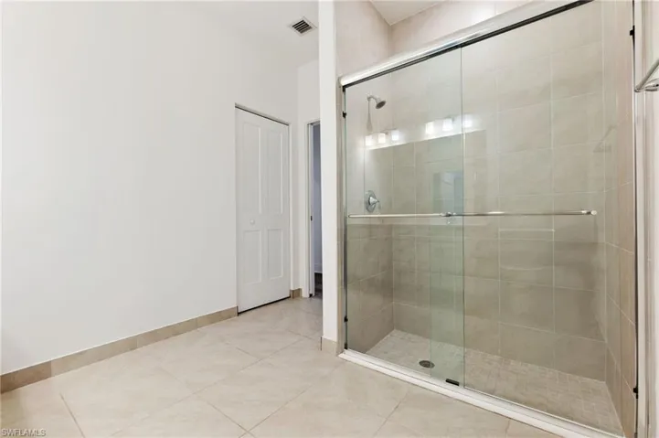 Features walk in shower and linen closet