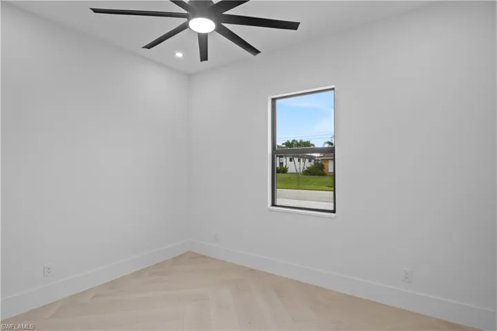 Empty room featuring recessed lighting and ceiling fan