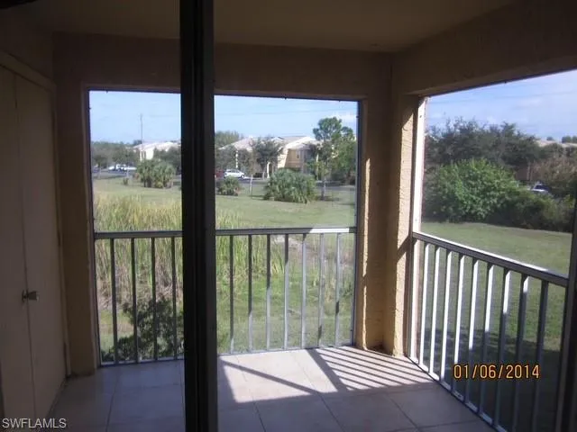 Balcony featuring a sunroom