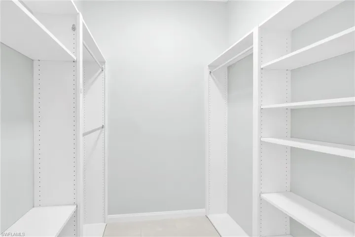 Custom shelving in walk-in closet