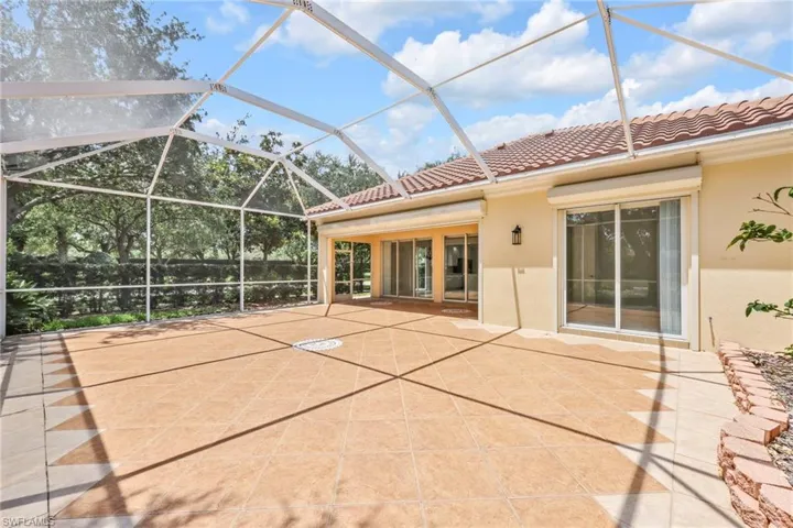 Screened-in Tiled Lanai and covered Patio , custom roll down electric shutters