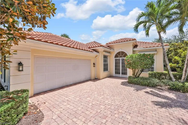 Corner lot with side LOAD entrance garage electric rolldowns , custom front screened entry