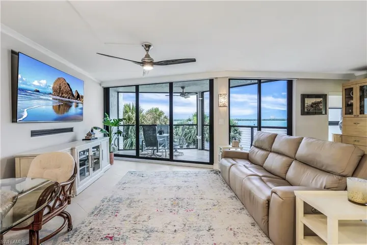 Tiled living room with a water view