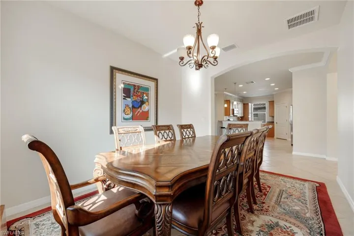 Dining room featuring an inviting chandelier and light tile patterned floors