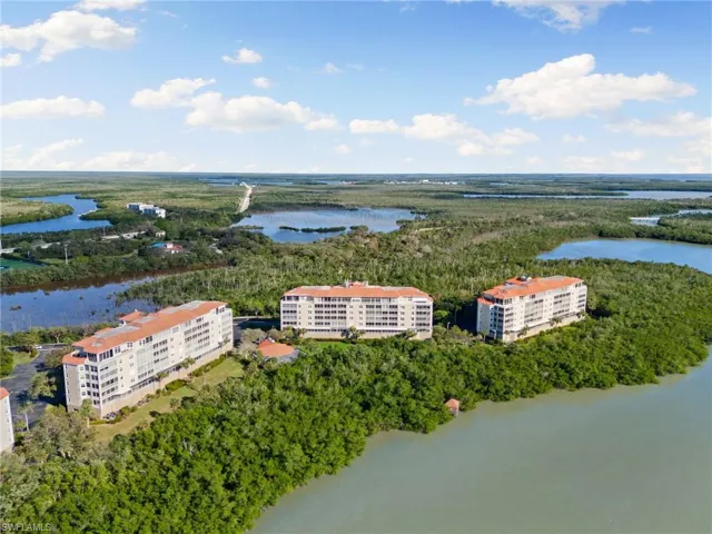 Birds eye view of property featuring a water view