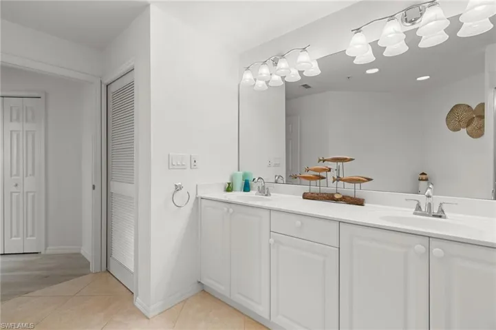 Bathroom with tile patterned flooring and vanity