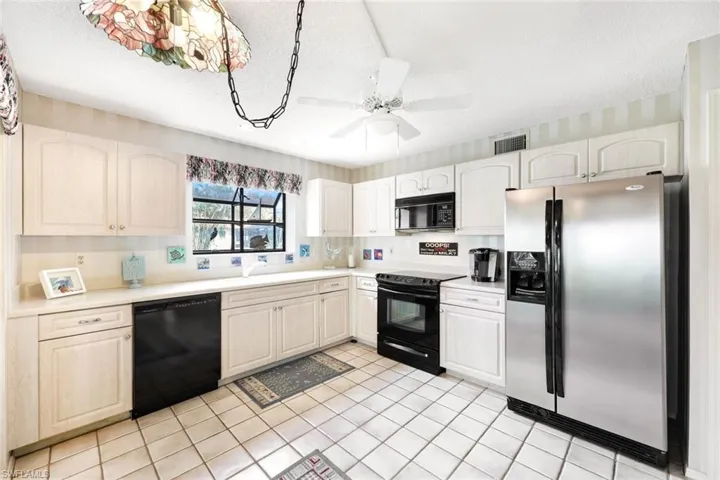 All appliances convey with the sale, including the dishwasher, glass-top range, microwave, refrigerator, and washer/dryer.