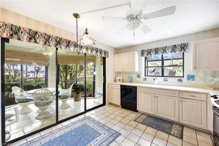 Triple sliding glass doors in the Kitchen lead to the sunny Florida room.
