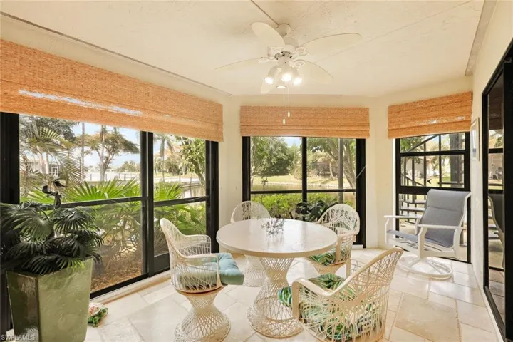 Sunny Florida Room has a partial view of the canal!