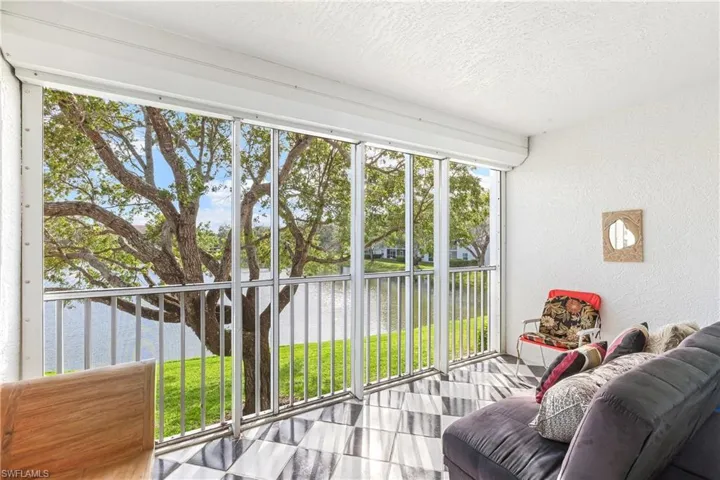 Screened Sunroom featuring a water view