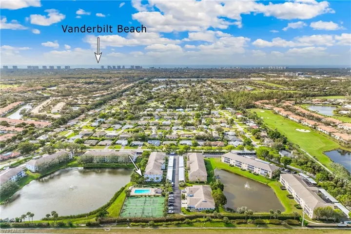 Aerial view featuring a water view and proximity to Beach