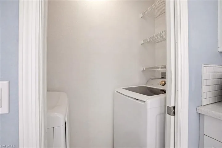 Dedicated laundry closet with wire shelving