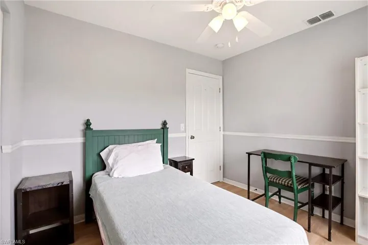 Light-toned walls with chair rail molding