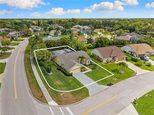 Corner lot aerial view of home